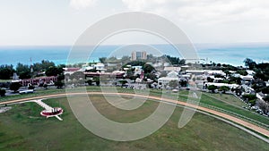 Aerial camera lifts over Garrison Savannah racecourse Bridgetown, Barbados