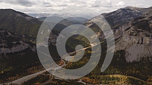 Aerial Canadian Rockies in fall colours overlooking mountain valleys