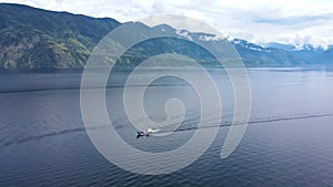 Aerial: A cargo barge on the Teletskoye Lake in the middle of the mountains