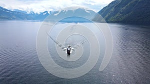 Aerial: A cargo barge on the Teletskoye Lake in the middle of the mountains