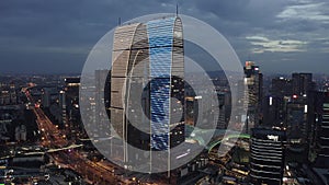 Aerial of CBD buildings by Jinji Lake at night in Suzhou, China