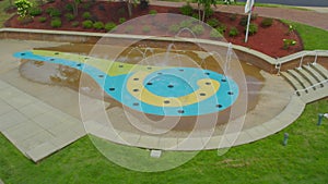 Aerial circle left to right of water fountain with scenic view