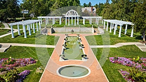 Aerial circular and rectangle pools of water leading to gorgeous outdoor wedding location at park