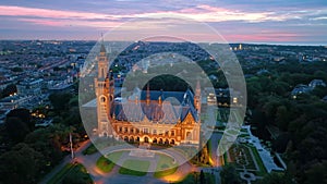 Aerial city night illumination famous Peace Palace Vredespaleis.