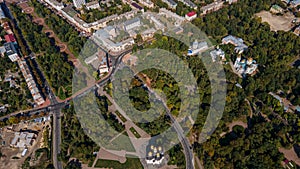 Aerial city scape photo of ancient european Chernihiv town with church, trees and buildings near roads