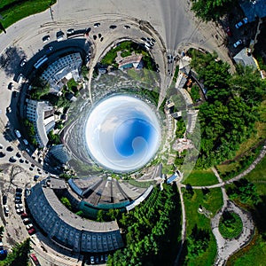 Aerial city view with crossroads and roads, houses buildings. Copter shot. Panoramic image.