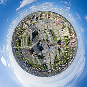 Aerial city view with crossroads and roads, houses buildings. Copter shot. Panoramic image.