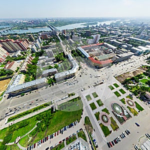 Aerial city view with crossroads and roads, houses buildings. Copter shot. Panoramic image.