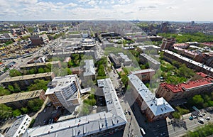 Aerial city view with crossroads and roads, houses buildings. Copter shot. Panoramic image.