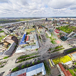 Aerial city view with crossroads and roads, houses buildings. Copter shot. Panoramic image.