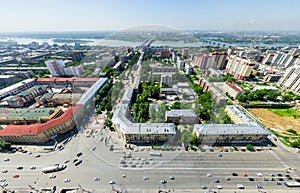 Aerial city view with crossroads and roads, houses buildings. Copter shot. Panoramic image.