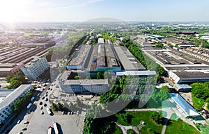 Aerial city view with crossroads and roads, houses buildings. Copter shot. Panoramic image.