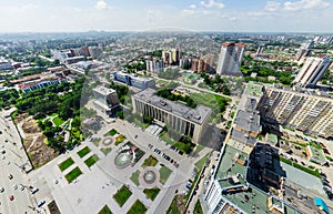 Aerial city view with crossroads and roads, houses buildings. Copter shot. Panoramic image.