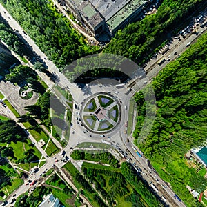 Aerial city view with crossroads and roads, houses buildings. Copter shot. Panoramic image.