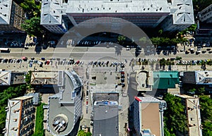 Aerial city view with crossroads and roads, houses buildings. Copter shot. Panoramic image.