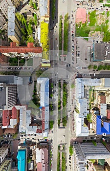 Aerial city view with crossroads and roads, houses buildings. Copter shot. Panoramic image.