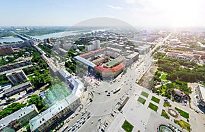 Aerial city view with crossroads and roads, houses buildings. Copter shot. Panoramic image.