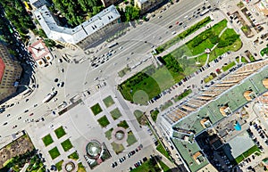 Aerial city view with crossroads and roads, houses buildings. Copter shot. Panoramic image.