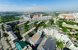 Aerial city view with crossroads and roads, houses buildings. Copter shot. Panoramic image.