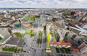 Aerial city view with crossroads and roads, houses buildings. Copter shot. Panoramic image.