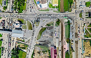 Aerial city view with crossroads and roads, houses buildings. Copter shot. Panoramic image.