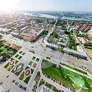 Aerial city view with crossroads and roads, houses buildings. Copter shot. Panoramic image.