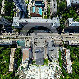 Aerial city view with crossroads and roads, houses buildings. Copter shot. Panoramic image.