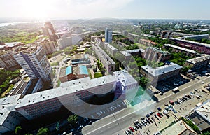 Aerial city view with crossroads and roads, houses buildings. Copter shot. Panoramic image.