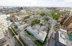 Aerial city view with crossroads and roads, houses buildings. Copter shot. Panoramic image.