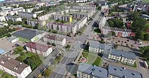 Aerial city view with modern houses, roads, trees. 4k Drone shot.