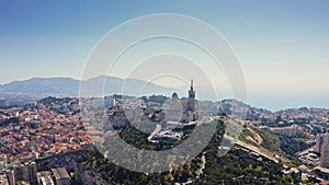 Aerial cityscape view from flying drone of european touristic port city Marseille in France on Mediterranean coast