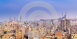 Aerial cityscape view of old Cairo, Egypt with Cairo Citadel and Sultan Hasan Mosque in far distance