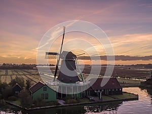 Aerial of classic dutch windmills at the Zaanse Schans during a stunning sunrise