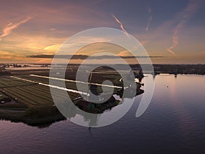 Aerial of classic dutch windmills at the Zaanse Schans during a stunning sunrise