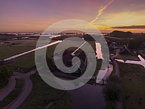 Aerial of classic dutch windmills at the Zaanse Schans during a stunning sunrise