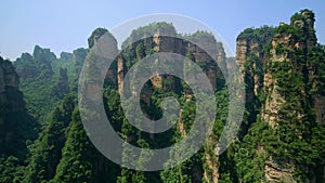 Aerial through cliffs & rock formations of the Zhangjiajie National Forest Park. Wulingyuan, Hunan, China