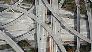 AERIAL: Close Flight over Judge Pregerson Huge Highway Connection showing multiple Roads, Bridges, Viaducts with little