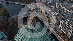 AERIAL: Close up of Berlin Cathedral, Germany in Fall colors at beautiful Sunset