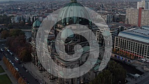 AERIAL: Close up of Berlin Cathedral, Germany in Fall colors at beautiful Sunset