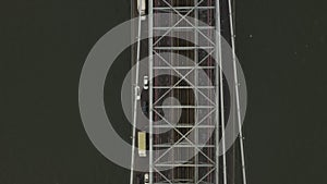 AERIAL: Close up Birds View flight over bridge with car traffic and Subway Train, Williamsburg Bridge, New York City