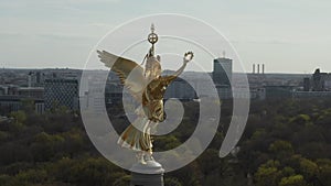 AERIAL: Close Up Circling around Berlin Victory Column Golden Statue Victoria in Beautiful Sunlight