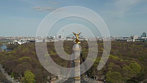 AERIAL: Close Up Dolly of Berlin Victory Column Golden Statue Victoria in Beautiful Sunlight and Berlin, Germany City