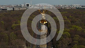 AERIAL: Close Up Dolly of Berlin Victory Column Golden Statue Victoria in Beautiful Sunlight and Berlin, Germany City