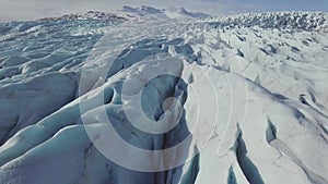 Aerial: Close up of Largest Glacier in Europe Vatnajokull. Beautiful glaciers flow through the mountains in Iceland. Concept