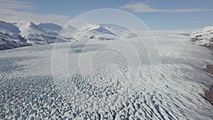 Aerial: Close up of Largest Glacier in Europe Vatnajokull. Beautiful glaciers flow through the mountains in Iceland. Concept