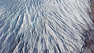 Aerial: Close up of Largest Glacier in Europe Vatnajokull. Beautiful glaciers flow through the mountains in Iceland. Concept