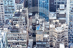 Aerial close up view of crowded buildings in New York City on a sunny day. Construction concept, crowded cities, and apartment