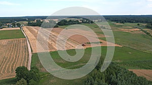 Aerial of a combine harvester working in the field in Poland