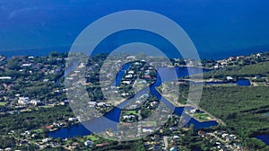 Aerial of community in Grand Cayman Islands with lush greenery