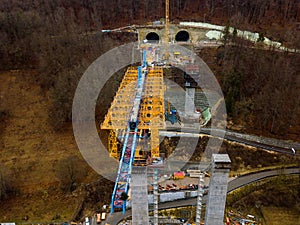 Aerial of a complex new railway bridge construction between two tunnels